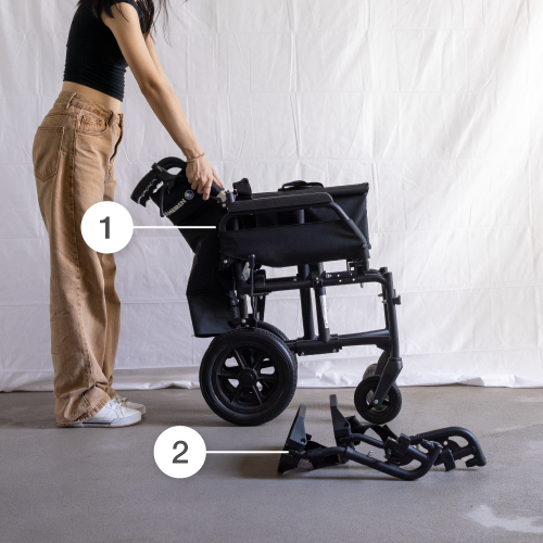 Woman Folding Bobby Astro 12 wheelchair